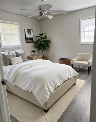 a bedroom with bed and a window