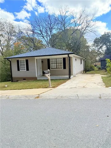 a house with trees in the background