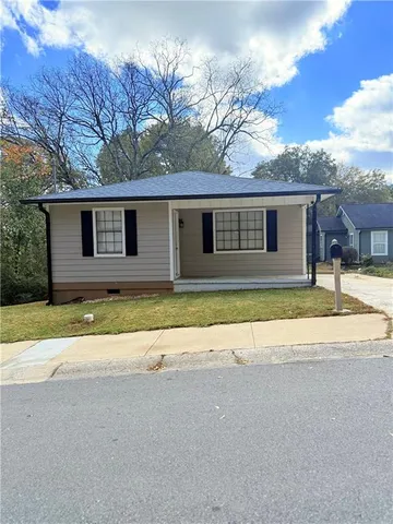 a house with trees in the background