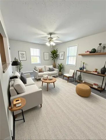 a living room with furniture and a chandelier