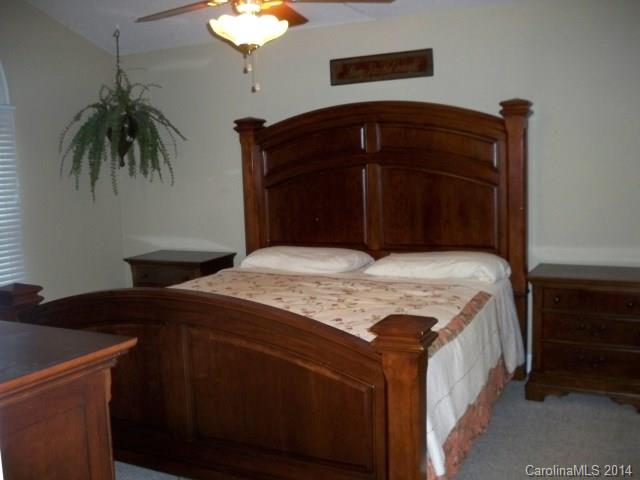 1850 George Brown Road Crouse, NC 28033 - Photo 11 of 23 a bedroom with a bed and a chandelier
