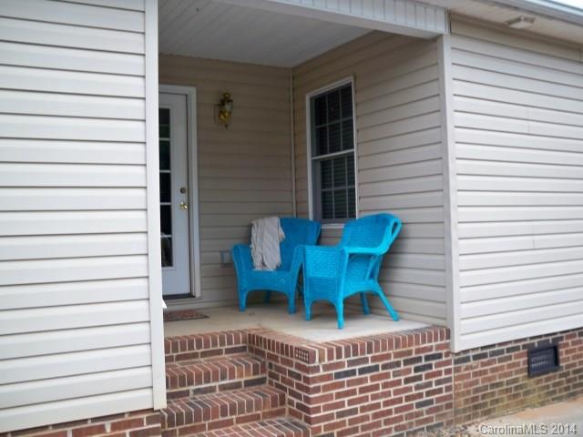 1850 George Brown Road Crouse, NC 28033 - Photo 6 of 23 a blue bench sitting in front of a house