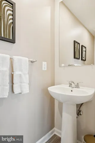 a bathroom with a sink and mirror