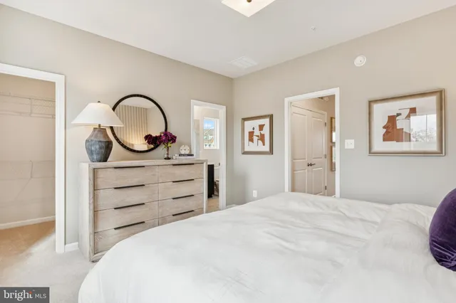 a bedroom with a bed and a dresser