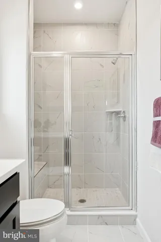 a bathroom with a shower and a toilet