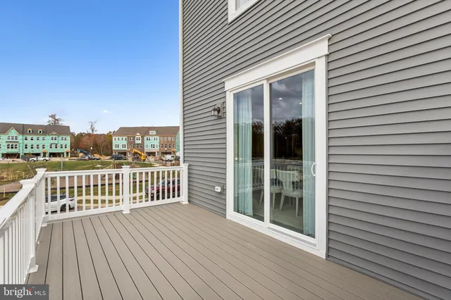 a view of a balcony with wooden floor