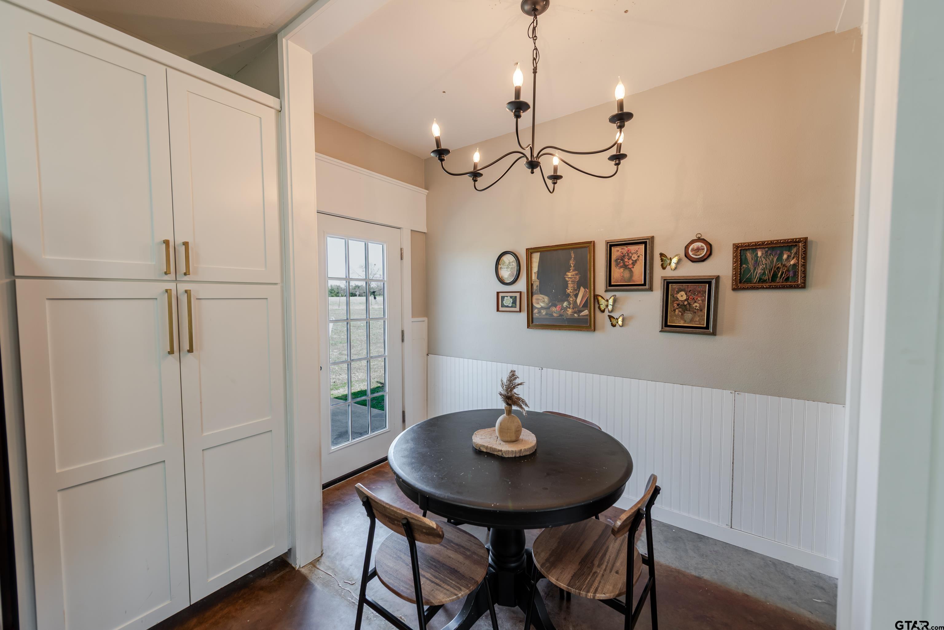 130 County Rd NW 1019 Mount Vernon, TX 75457 - Photo 12 of 17 a view of a dining room with furniture and wooden floor