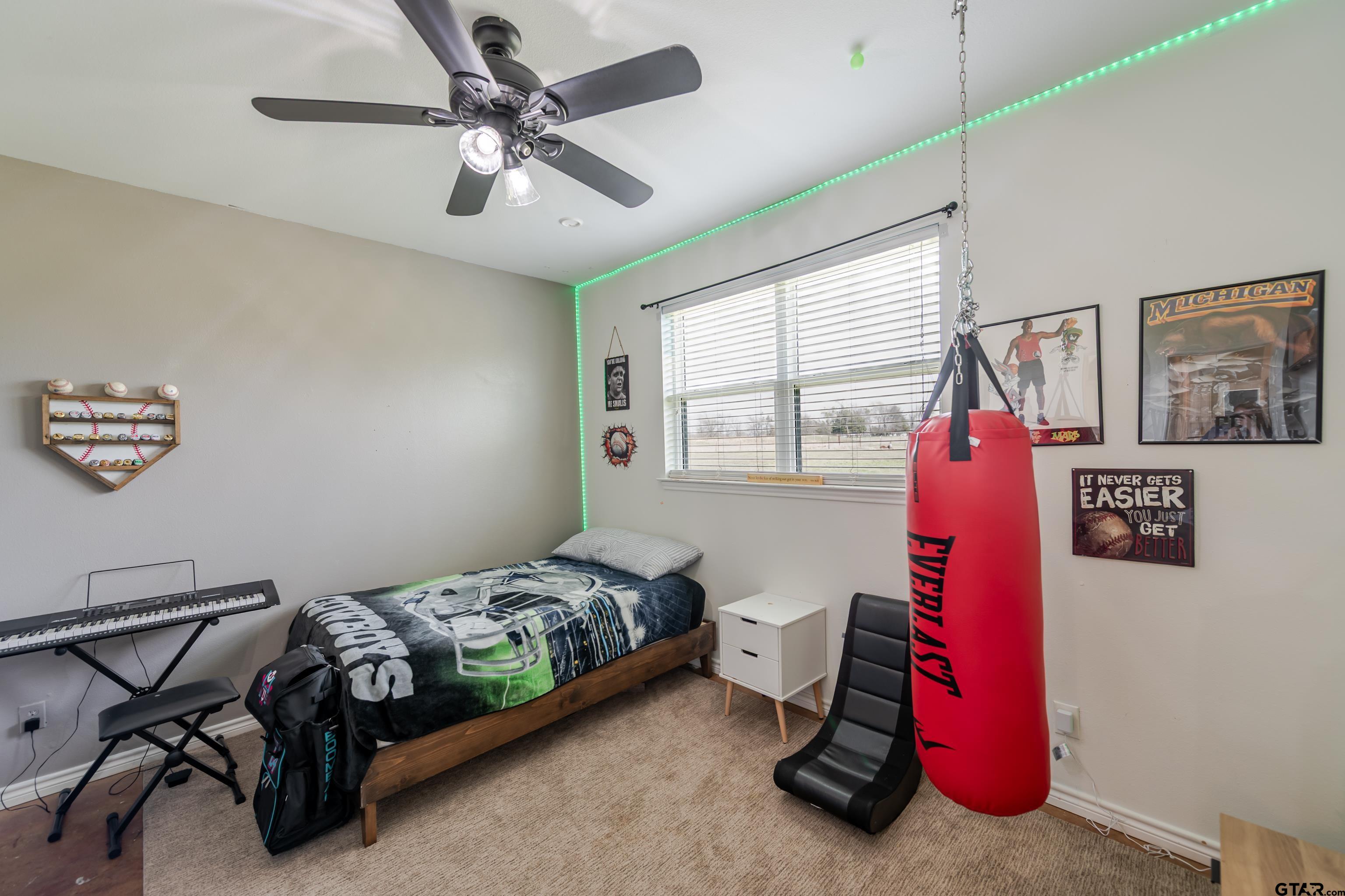 130 County Rd NW 1019 Mount Vernon, TX 75457 - Photo 13 of 17 a bedroom with furniture and a fan