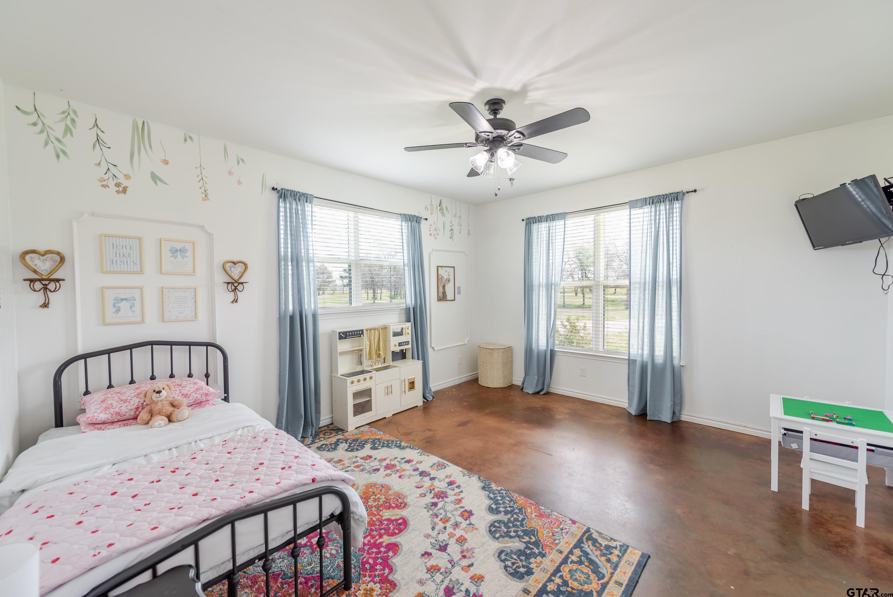 130 County Rd NW 1019 Mount Vernon, TX 75457 - Photo 14 of 17 a bedroom with a bed and a window