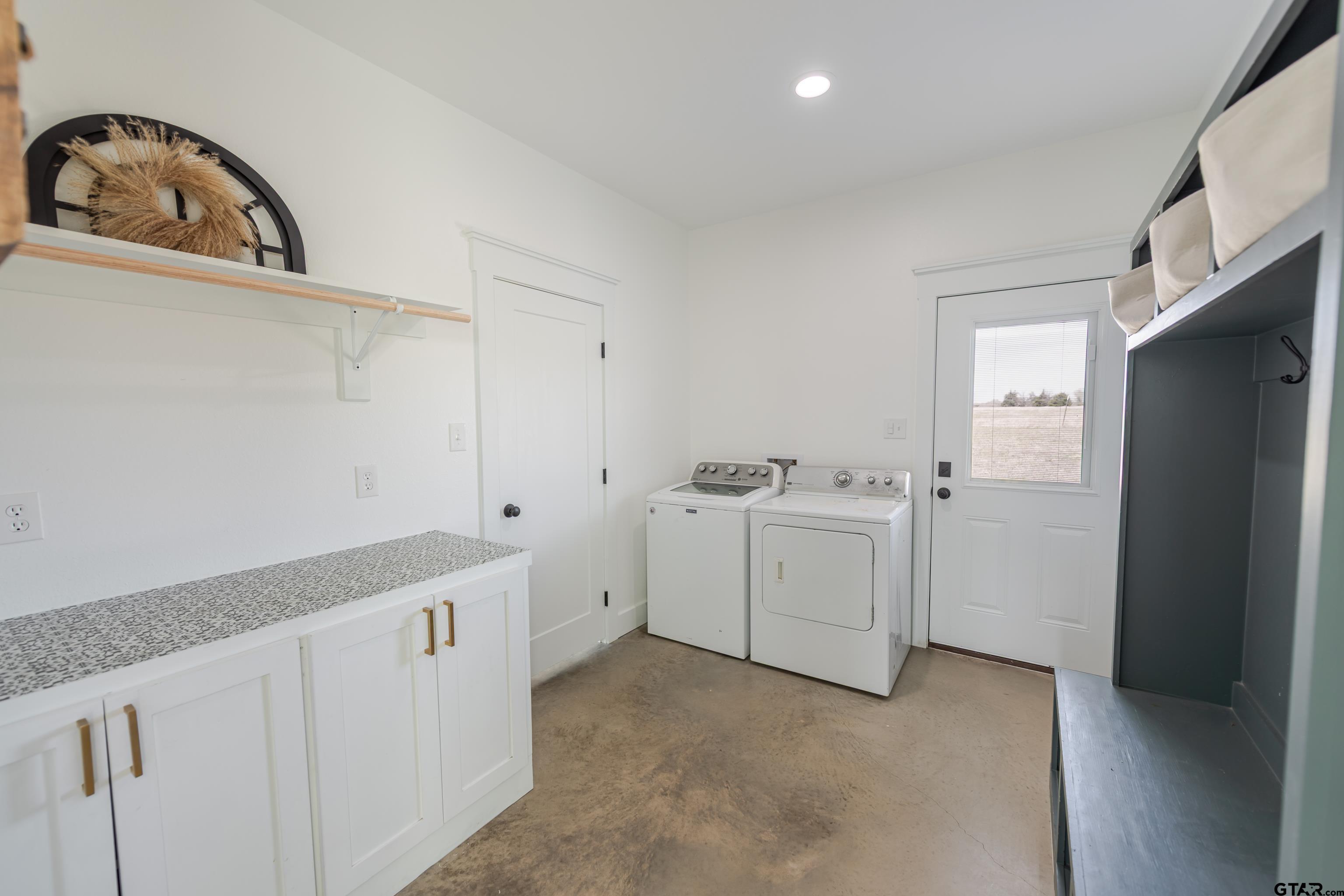 130 County Rd NW 1019 Mount Vernon, TX 75457 - Photo 16 of 17 a view of cabinets and utility room with closet