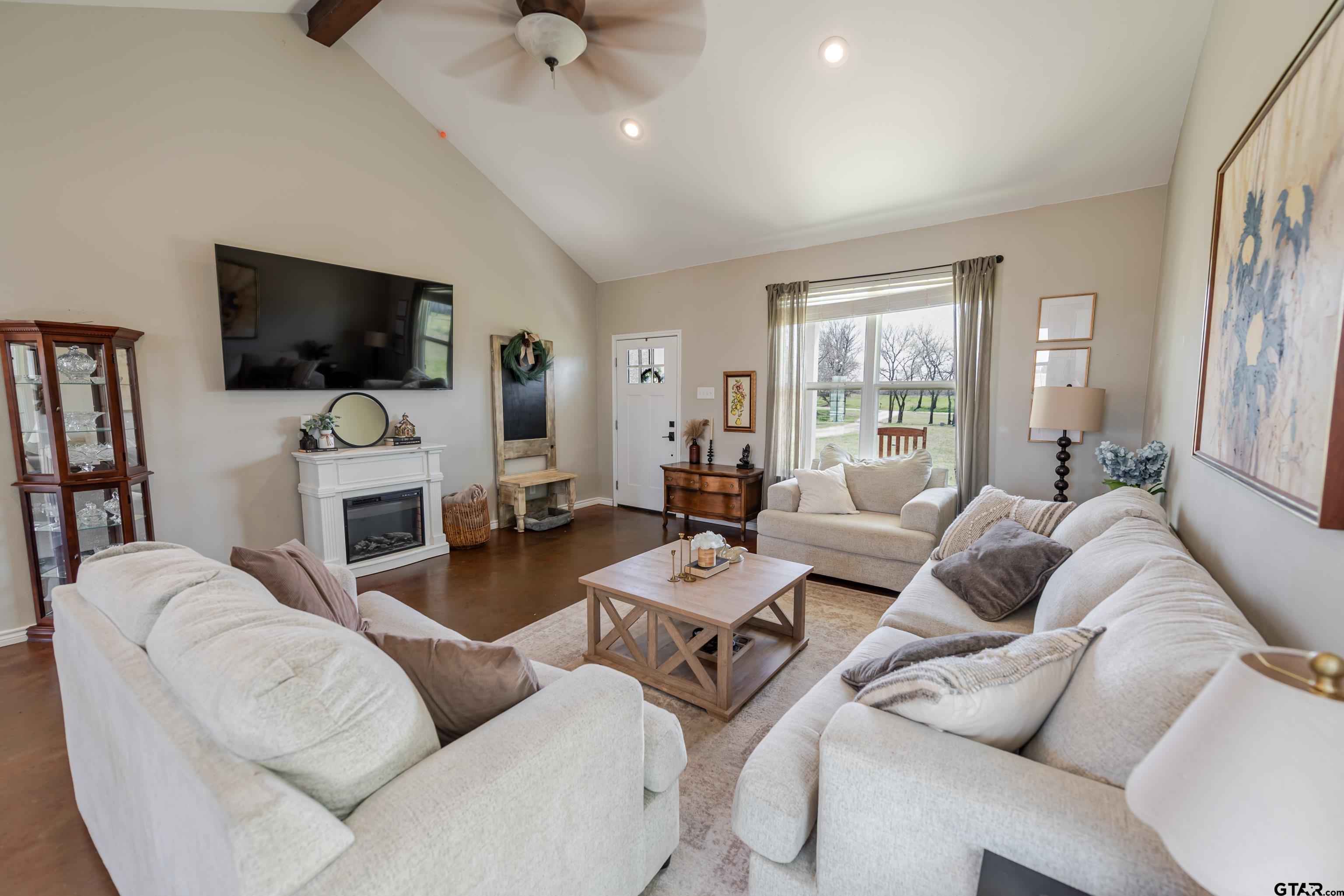 130 County Rd NW 1019 Mount Vernon, TX 75457 - Photo 2 of 17 a living room with furniture a flat screen tv and a window
