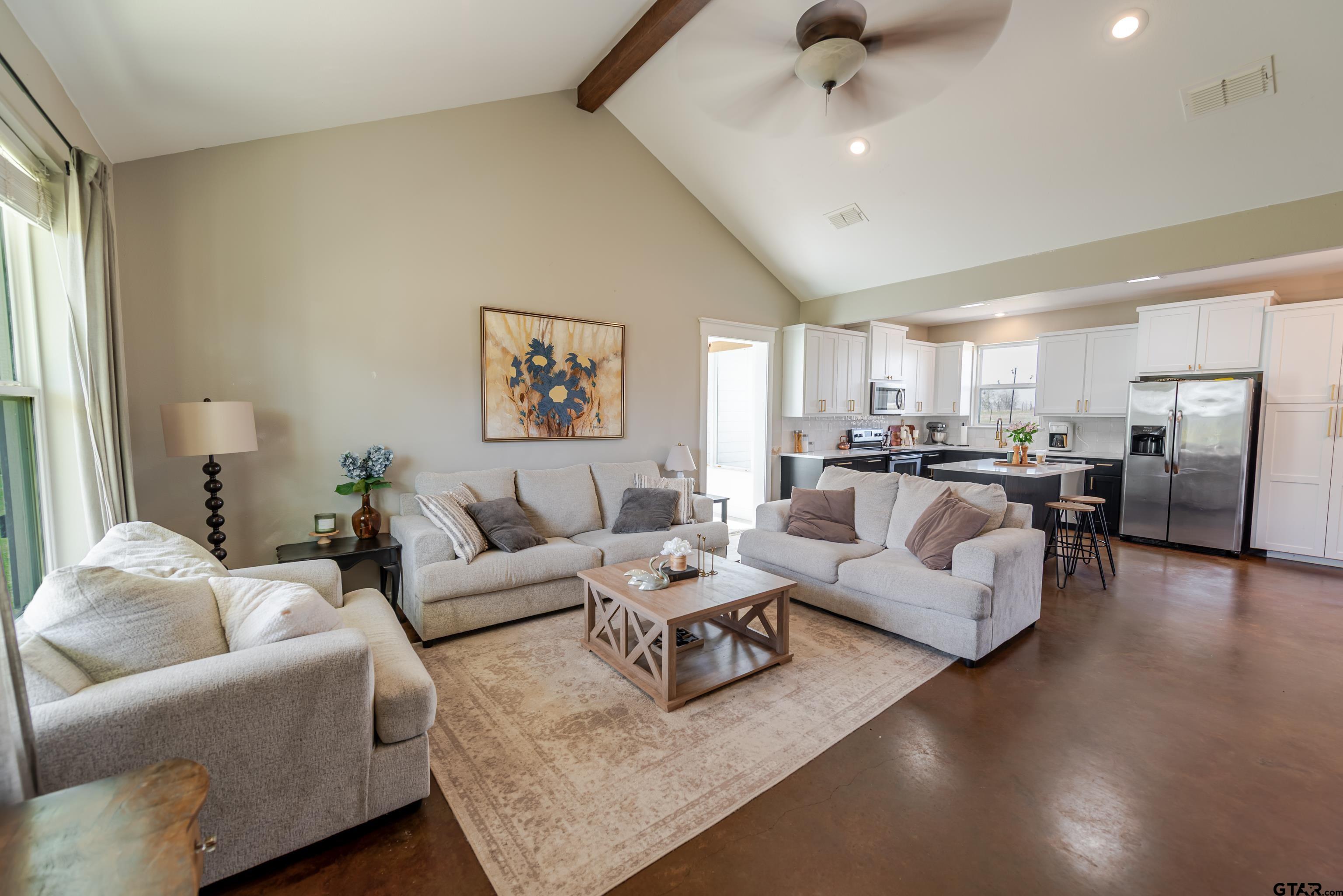 130 County Rd NW 1019 Mount Vernon, TX 75457 - Photo 10 of 17 a living room with furniture and a view of kitchen