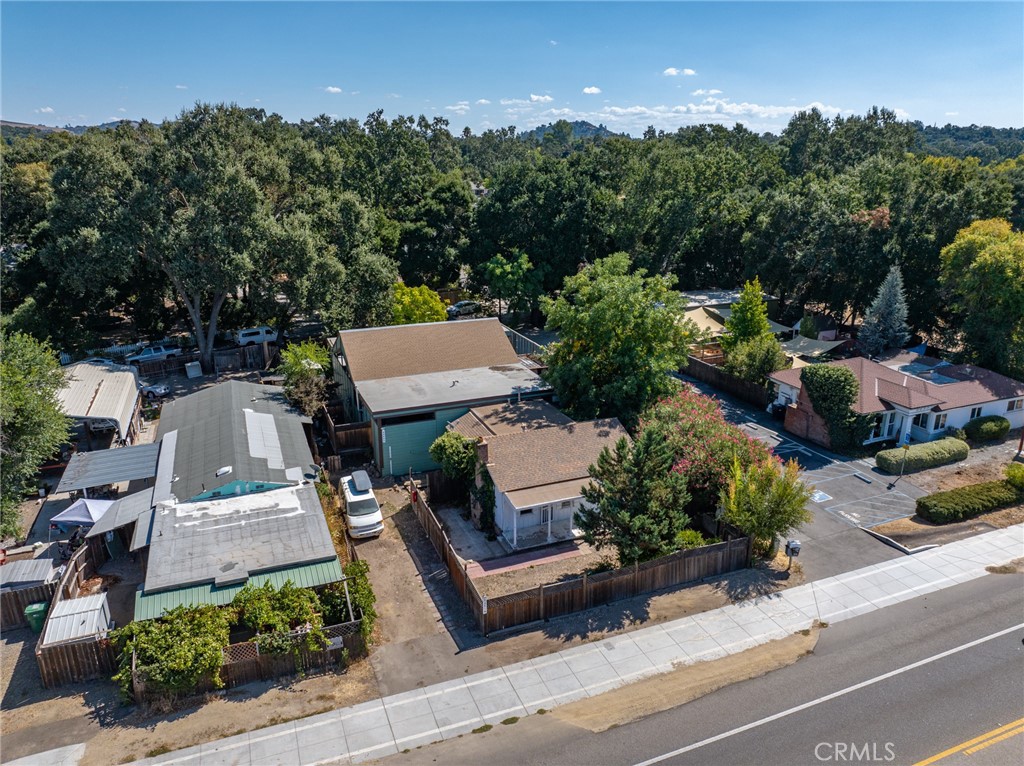an aerial view of a house with garden space and street view