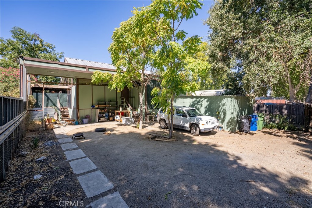 6865 Morro Road, Unit A Atascadero, CA 93422 - Photo 20 of 38 a view of a patio with table and chairs under an umbrella