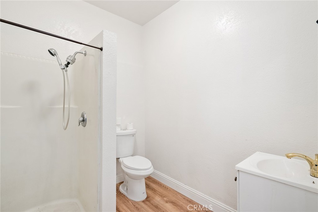 6865 Morro Road, Unit A Atascadero, CA 93422 - Photo 25 of 38 a white toilet sitting next to a shower