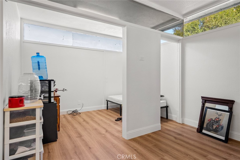 6865 Morro Road, Unit A Atascadero, CA 93422 - Photo 26 of 38 a view of a hallway to room with wooden floor and closet