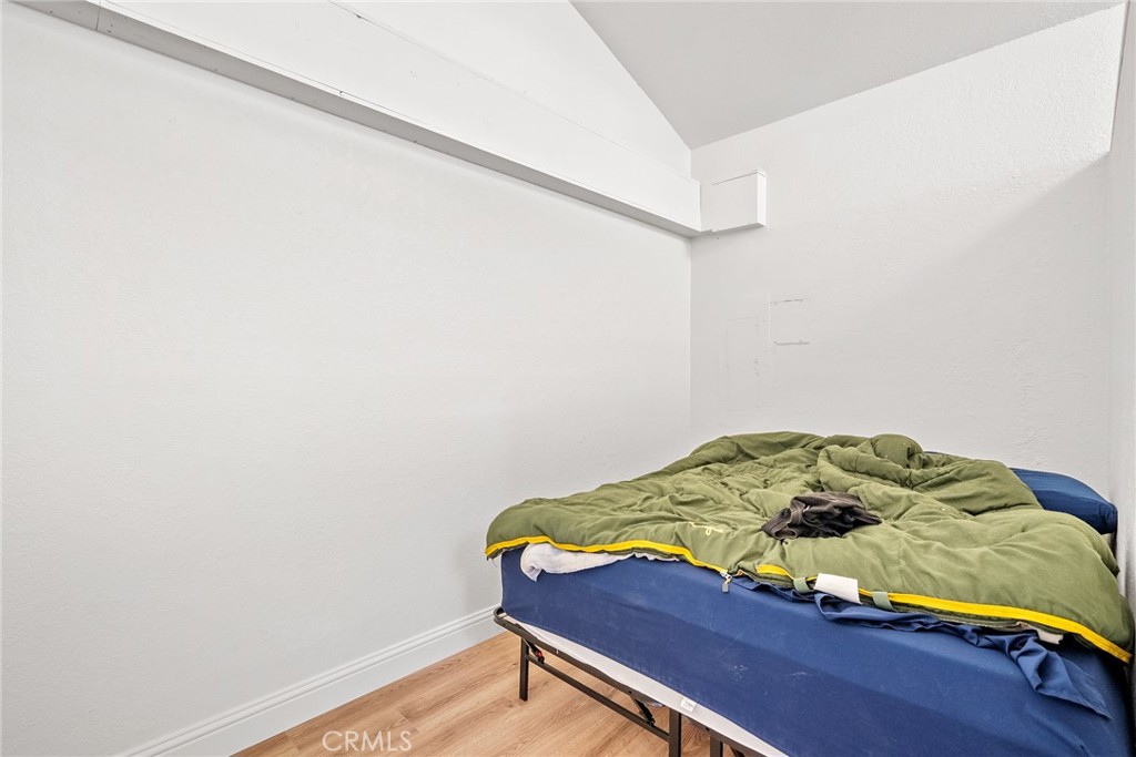 6865 Morro Road, Unit A Atascadero, CA 93422 - Photo 27 of 38 a bed sitting in a bedroom next to a window