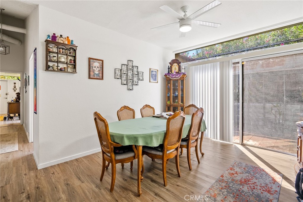 6865 Morro Road, Unit A Atascadero, CA 93422 - Photo 7 of 38 a view of a dining room with furniture and wooden floor