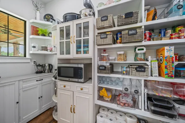 a kitchen with stainless steel appliances granite countertop a stove and cabinets