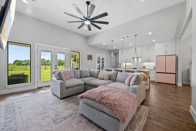 a living room with furniture and a large window
