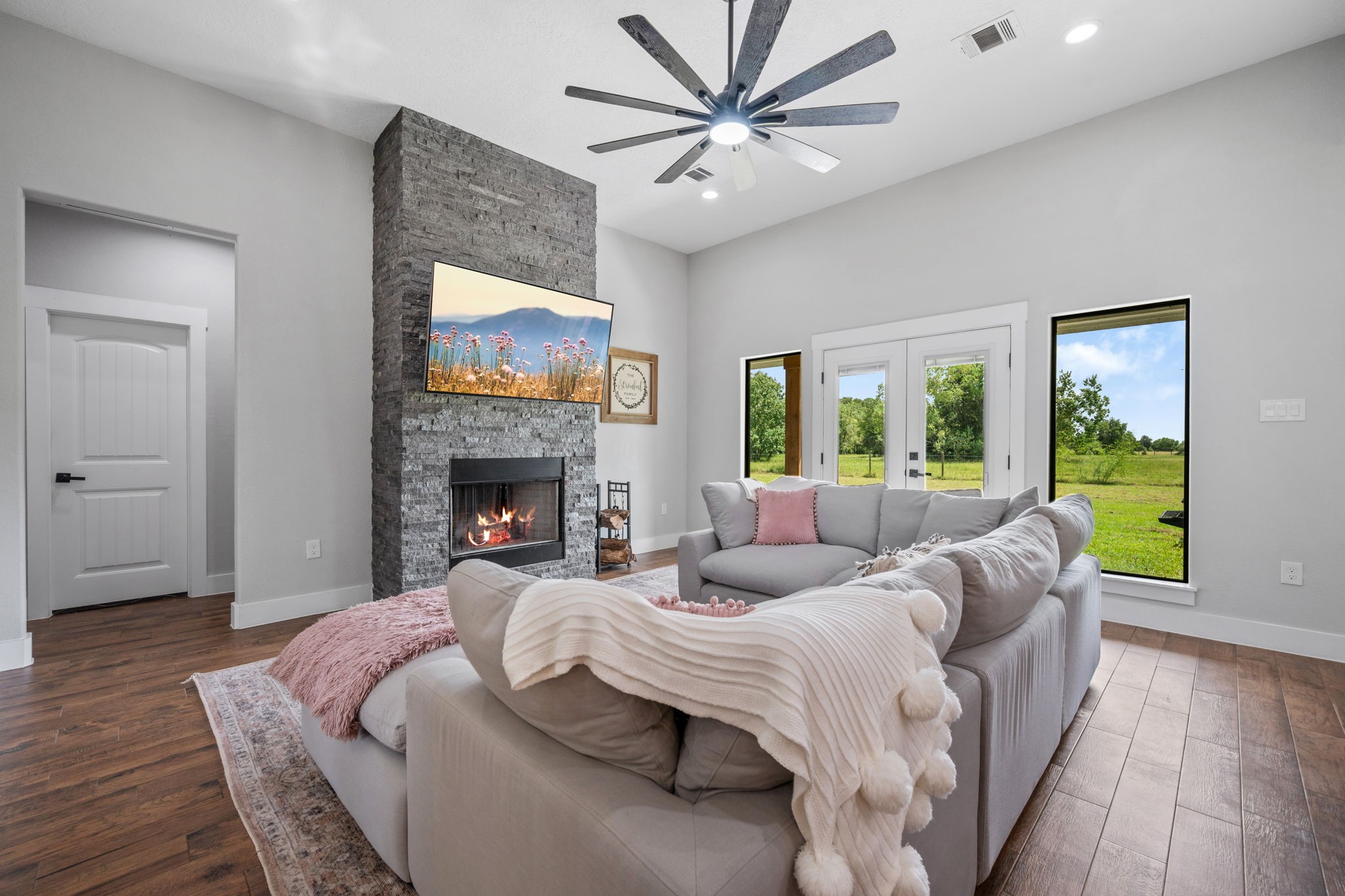 356 Barrow-White Road Anahuac, TX 77514 - Photo 15 of 30 a living room with furniture and a fireplace