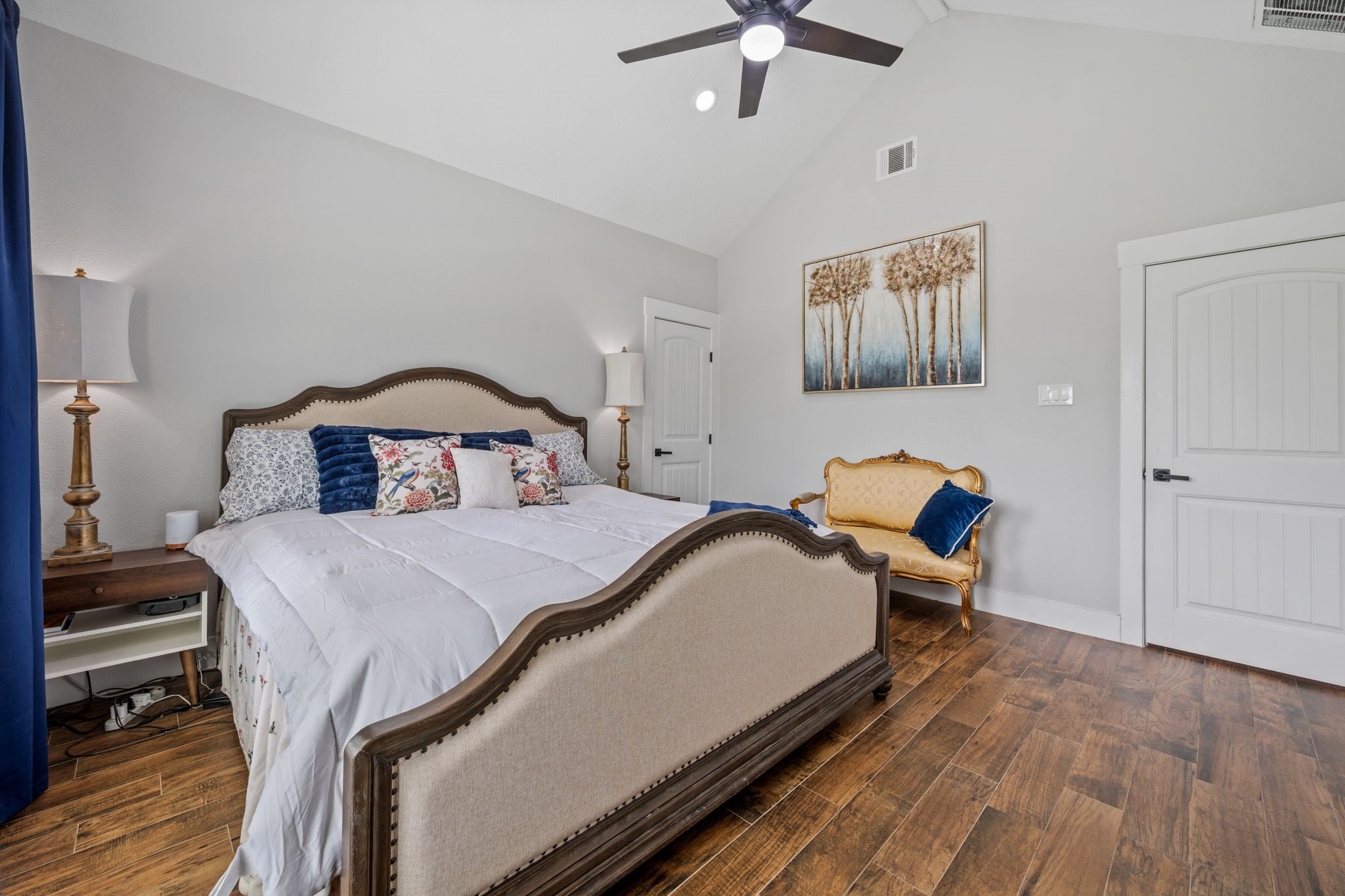 356 Barrow-White Road Anahuac, TX 77514 - Photo 18 of 30 a bedroom with a bed and wooden floor