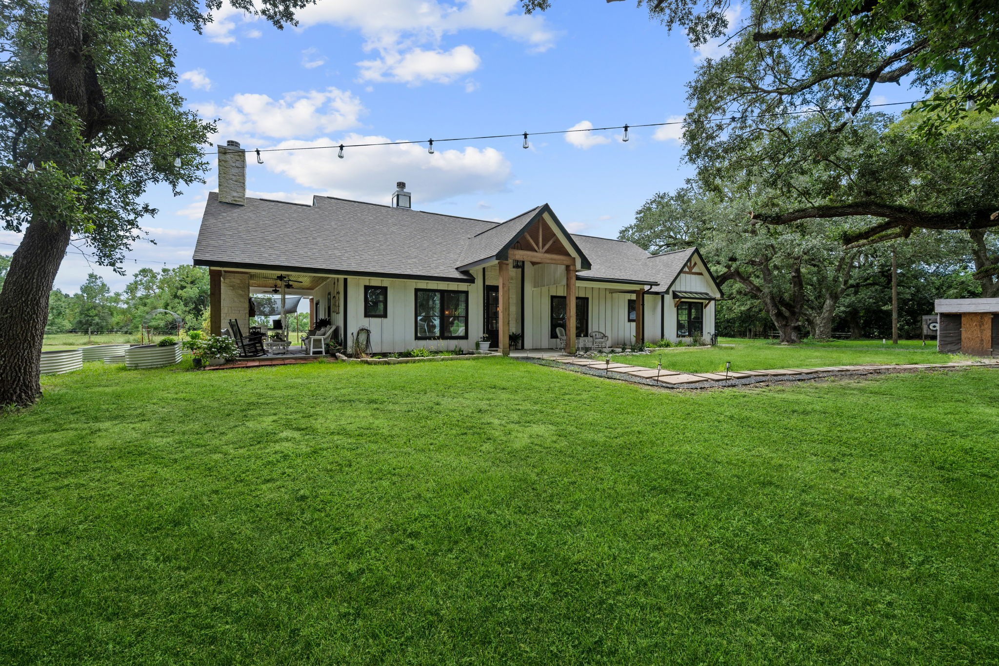 356 Barrow-White Road Anahuac, TX 77514 - Photo 2 of 30 a front view of a house with a yard