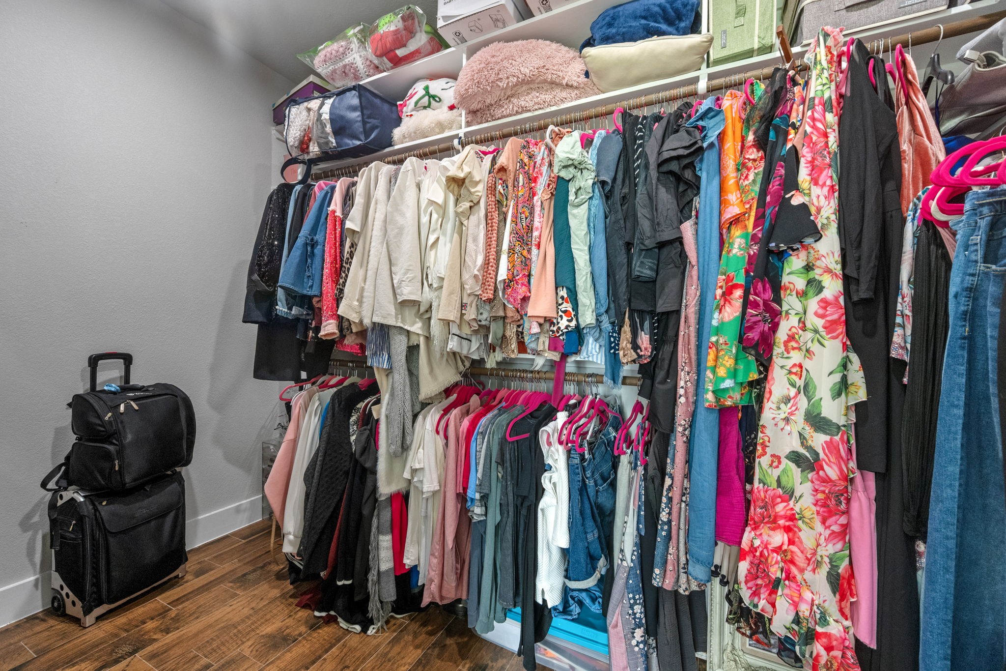 356 Barrow-White Road Anahuac, TX 77514 - Photo 21 of 30 a view of walk in closet with clothes