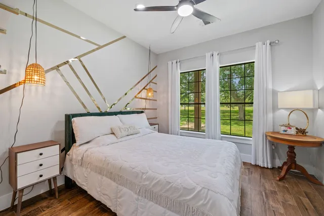 a bedroom with a bed and a table