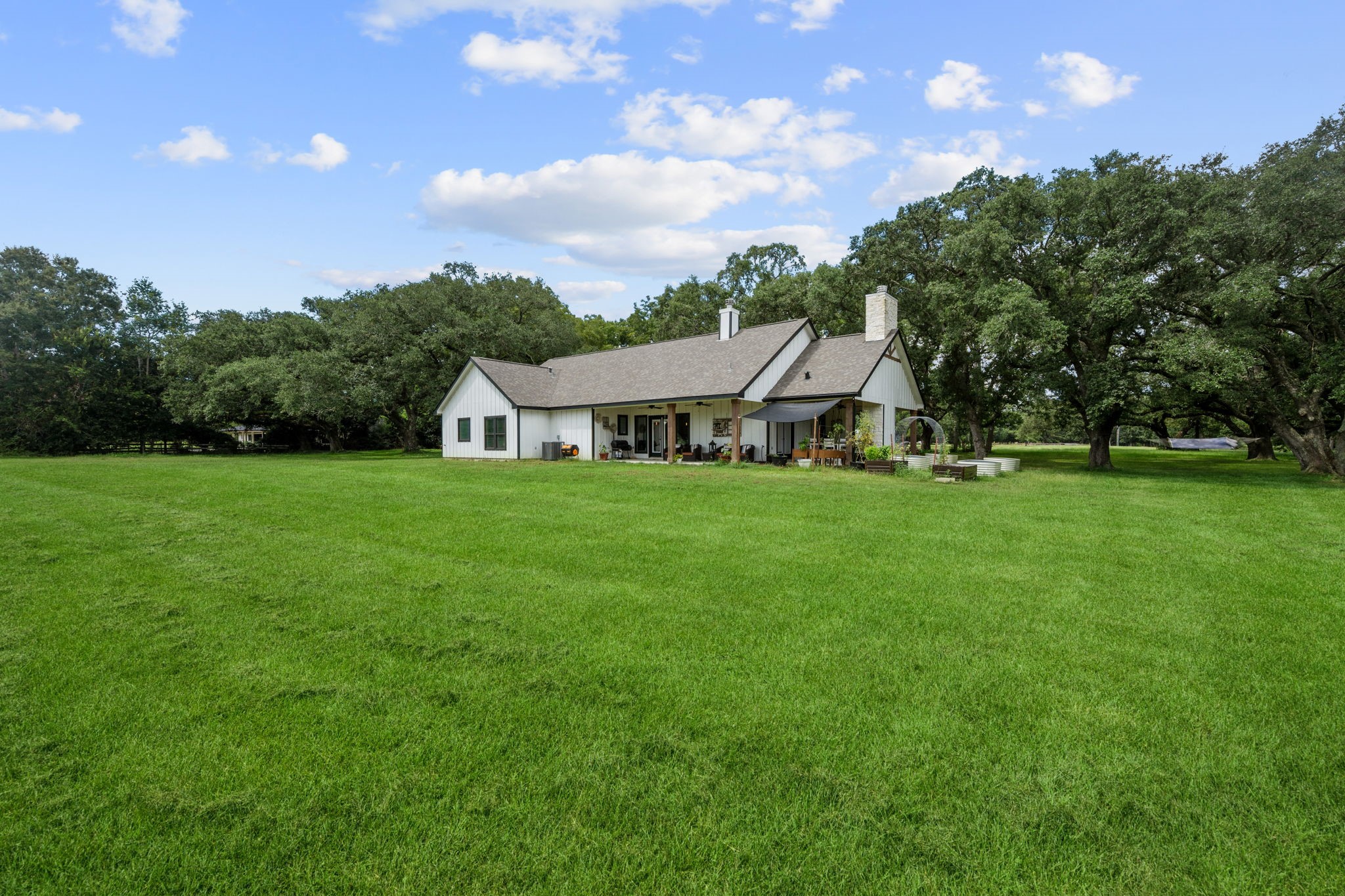 356 Barrow-White Road Anahuac, TX 77514 - Photo 27 of 30 a view of a house with a big yard