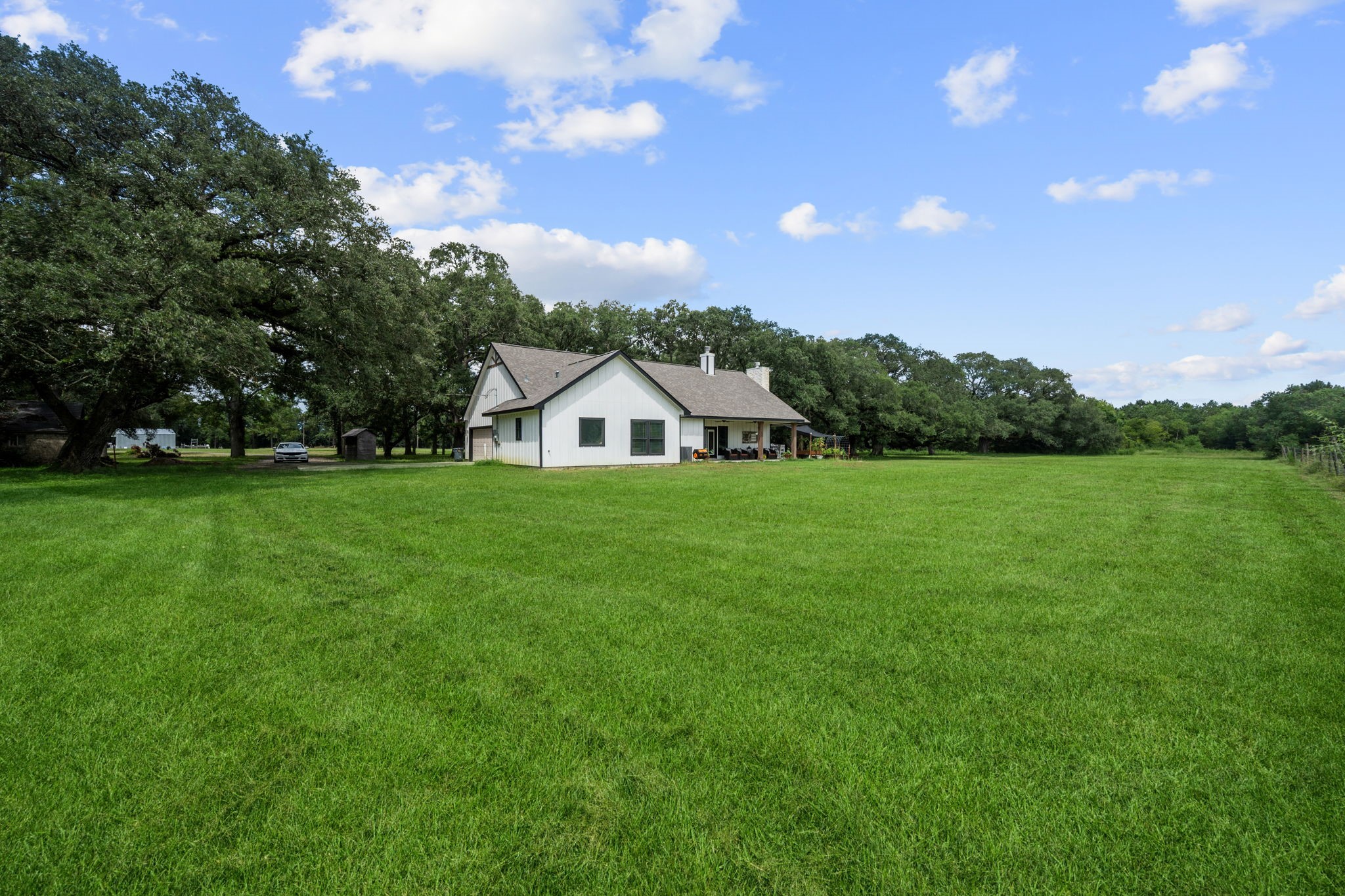 356 Barrow-White Road Anahuac, TX 77514 - Photo 28 of 30 a view of a house with a yard