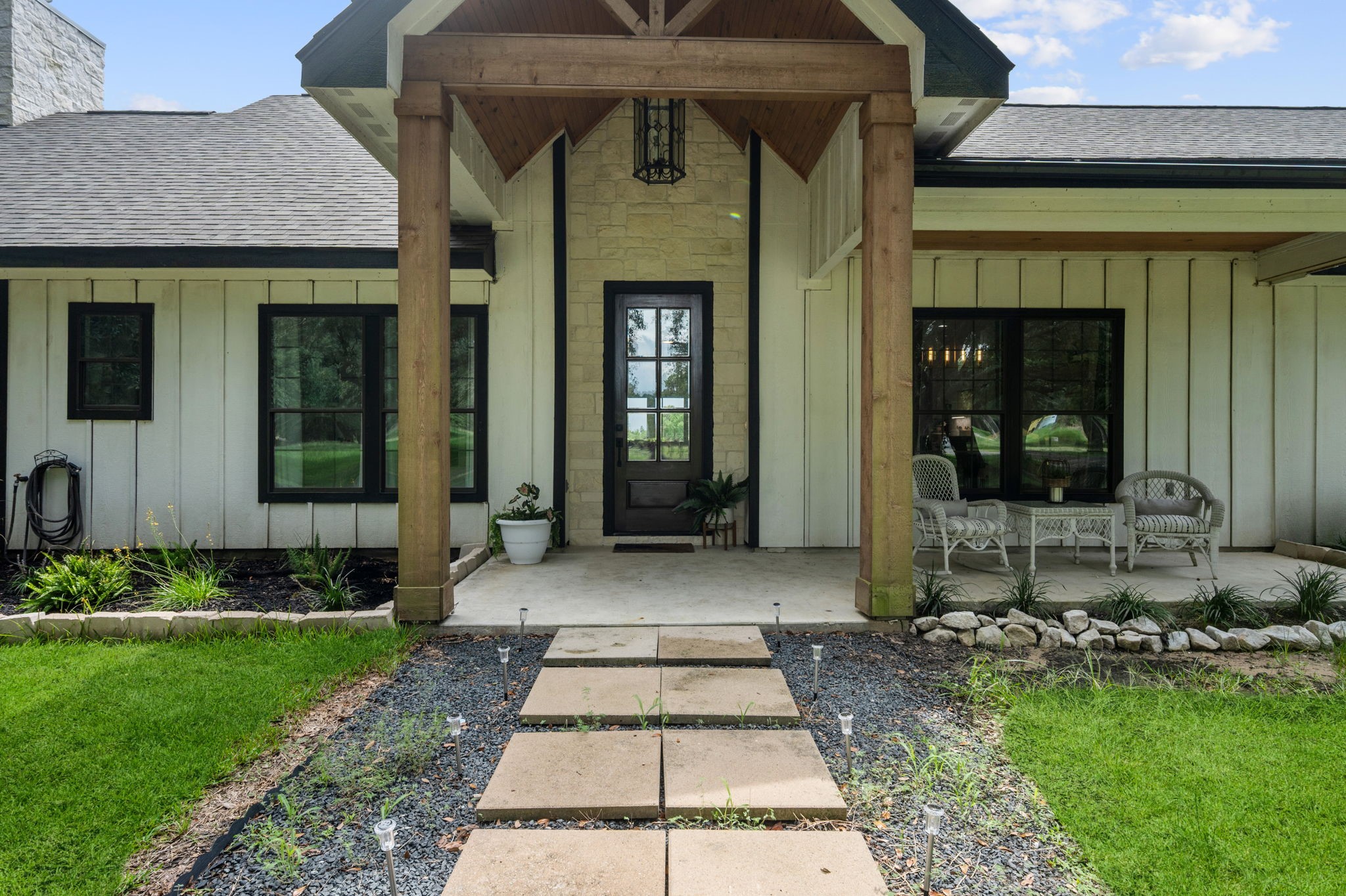 356 Barrow-White Road Anahuac, TX 77514 - Photo 3 of 30 a front view of a house with a yard