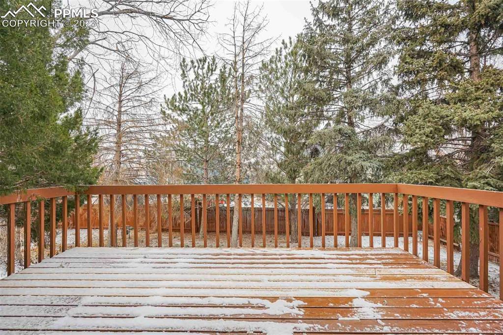 7228 River Bend Road Colorado Springs, CO 80911 - Photo 21 of 48 a view of a wooden deck