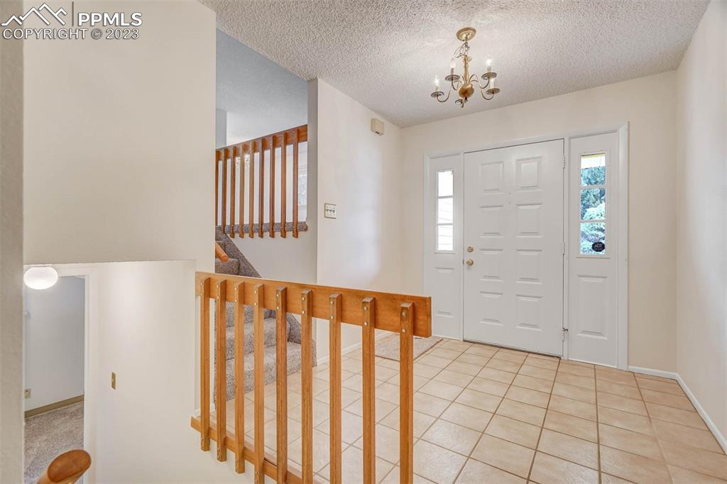 7228 River Bend Road Colorado Springs, CO 80911 - Photo 27 of 48 a view of a room with wooden floor