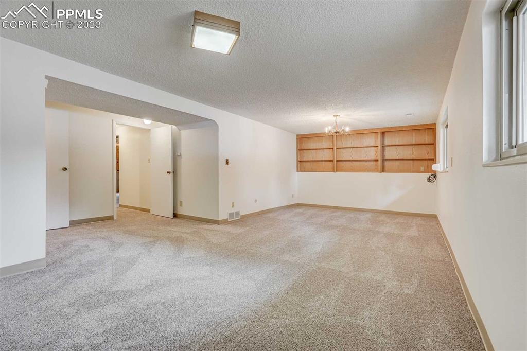 7228 River Bend Road Colorado Springs, CO 80911 - Photo 30 of 48 an empty room with windows