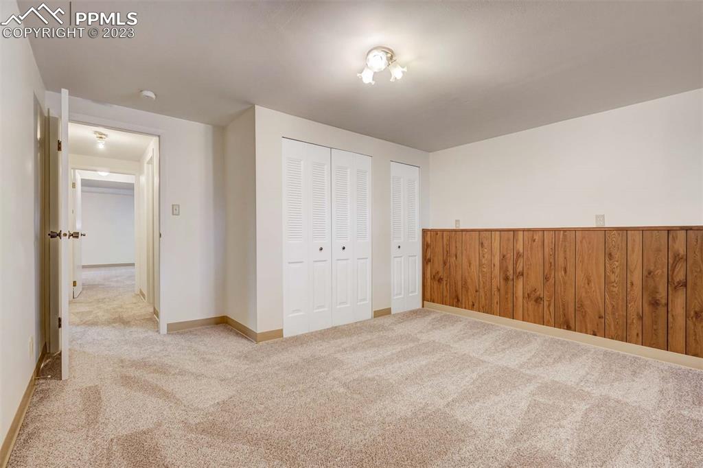 7228 River Bend Road Colorado Springs, CO 80911 - Photo 32 of 48 an empty room with a mirror