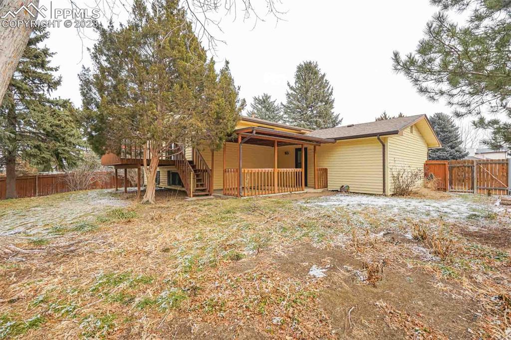 7228 River Bend Road Colorado Springs, CO 80911 - Photo 42 of 48 a backyard of a house with table and chairs