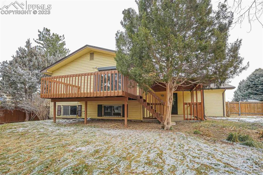 7228 River Bend Road Colorado Springs, CO 80911 - Photo 44 of 48 a front view of a house with a garden
