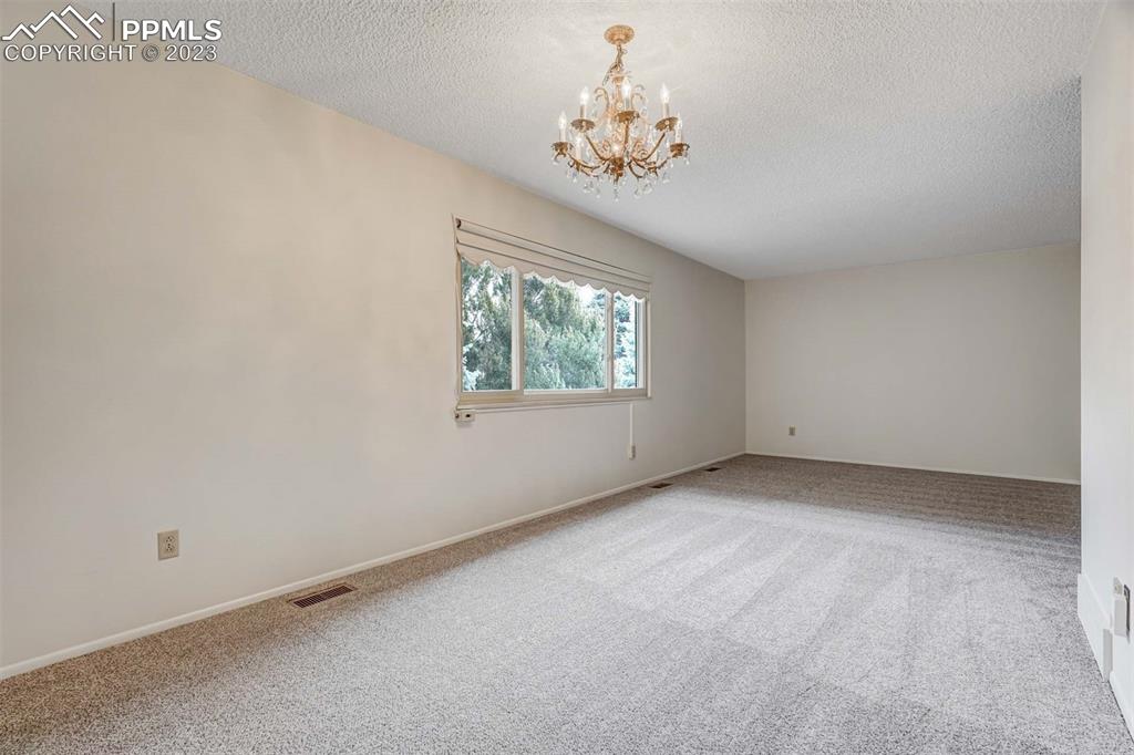 7228 River Bend Road Colorado Springs, CO 80911 - Photo 7 of 48 an empty room with a window