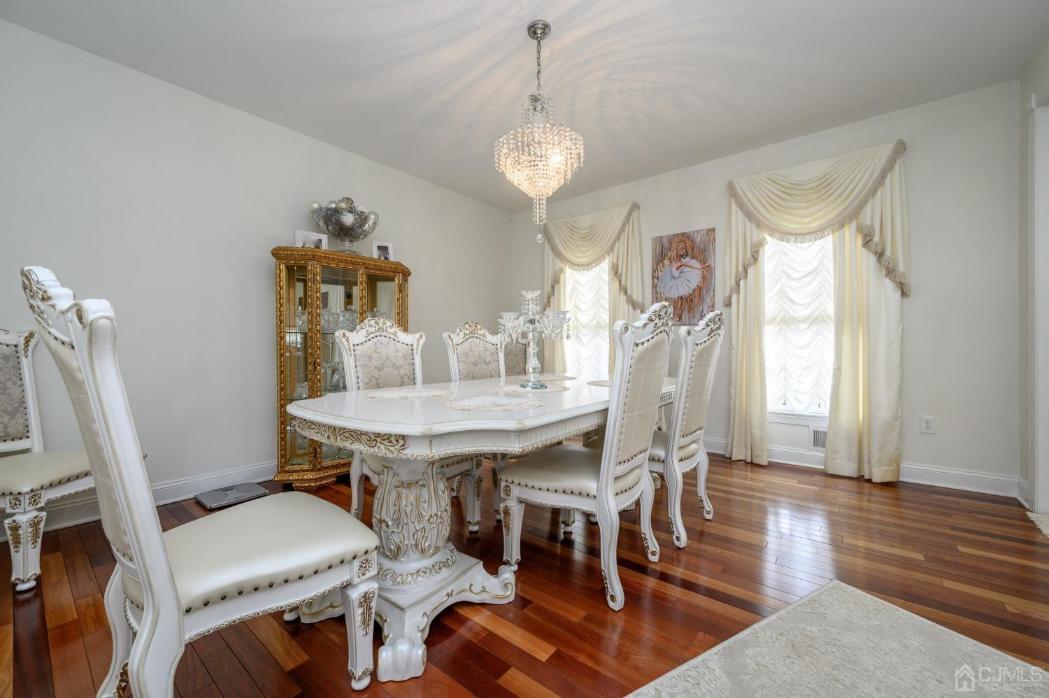 36 Shurts Road Asbury, NJ 08802 - Photo 8 of 56 a dining room with furniture a chandelier and wooden floor