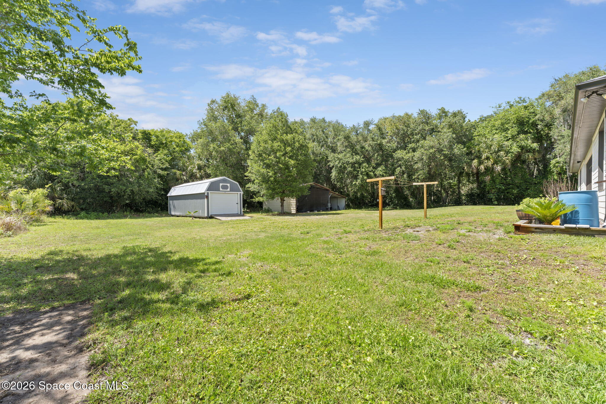 1740 Ford Road Mims, FL 32754 - Photo 40 of 43 a house view with a garden space