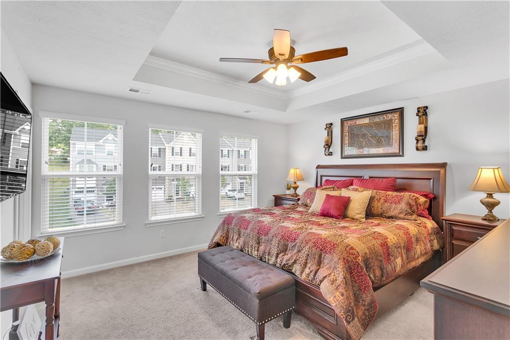 149 Providence Way Pittsburgh, PA 15234 - Photo 15 of 29 a bedroom with a bed and a chandelier