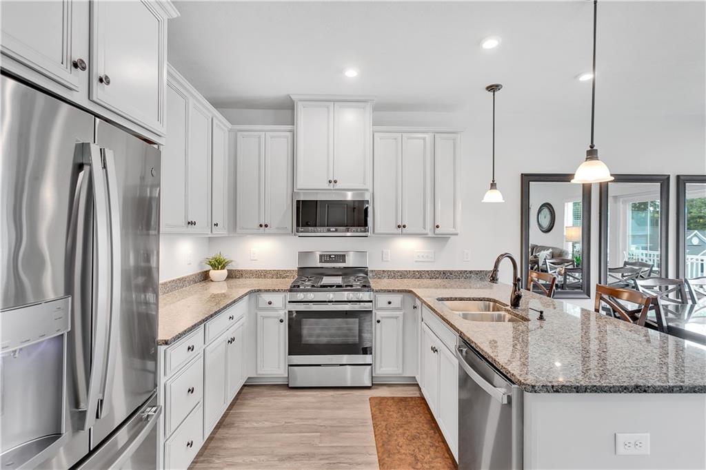 149 Providence Way Pittsburgh, PA 15234 - Photo 2 of 29 a kitchen with stainless steel appliances granite countertop a sink stove and refrigerator
