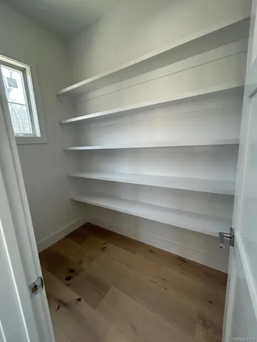 a refrigerator sitting in a bedroom next to a window