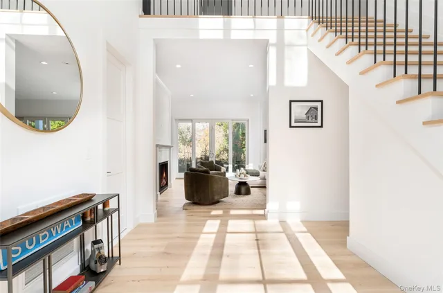 a view of living room and kitchen with wooden floor