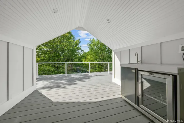 a view of a room with wooden floor and iron gate