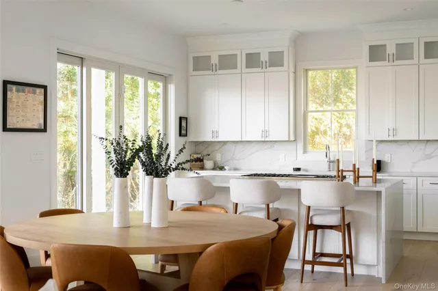 a kitchen with a table chairs and microwave