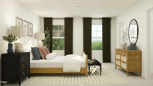 a bedroom with a bed couch and a window