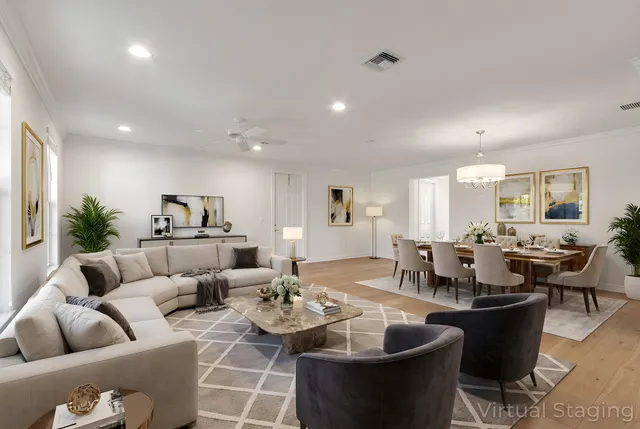 a living room with furniture kitchen view and a large window