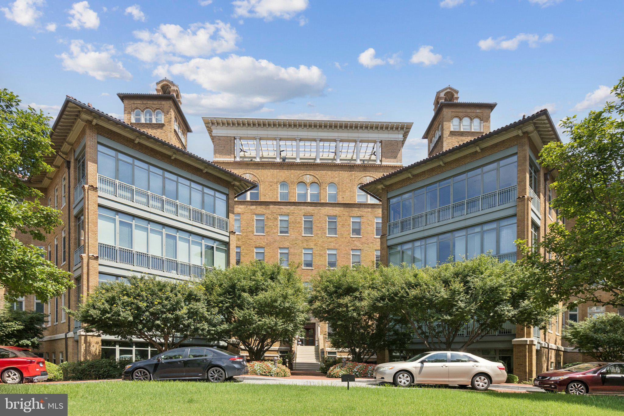 2425 L Street Northwest, Unit 210 Washington, DC 20037 - Photo 2 of 39 a front view of a building with garden